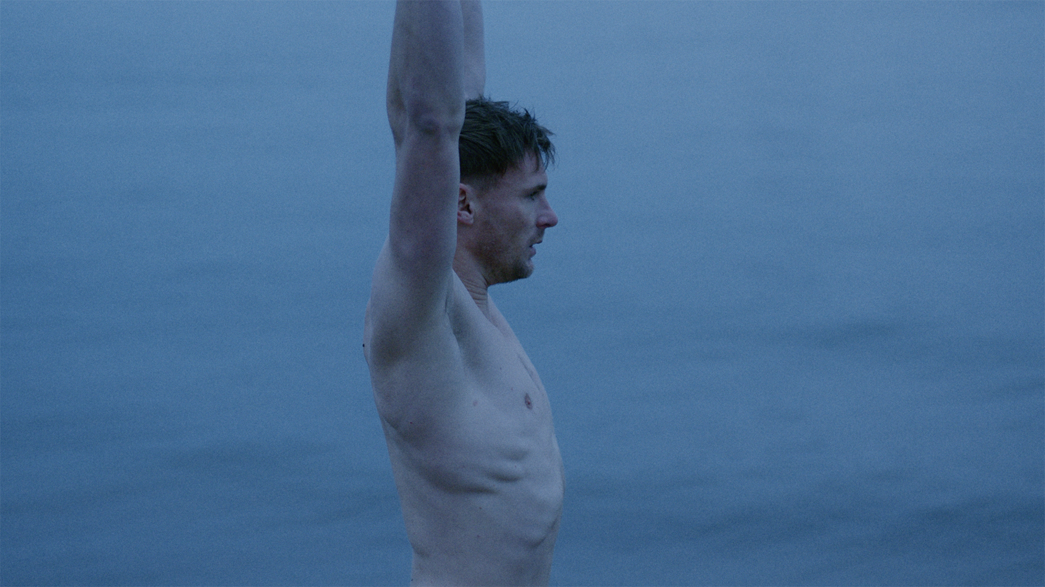 man standing behind blue sky