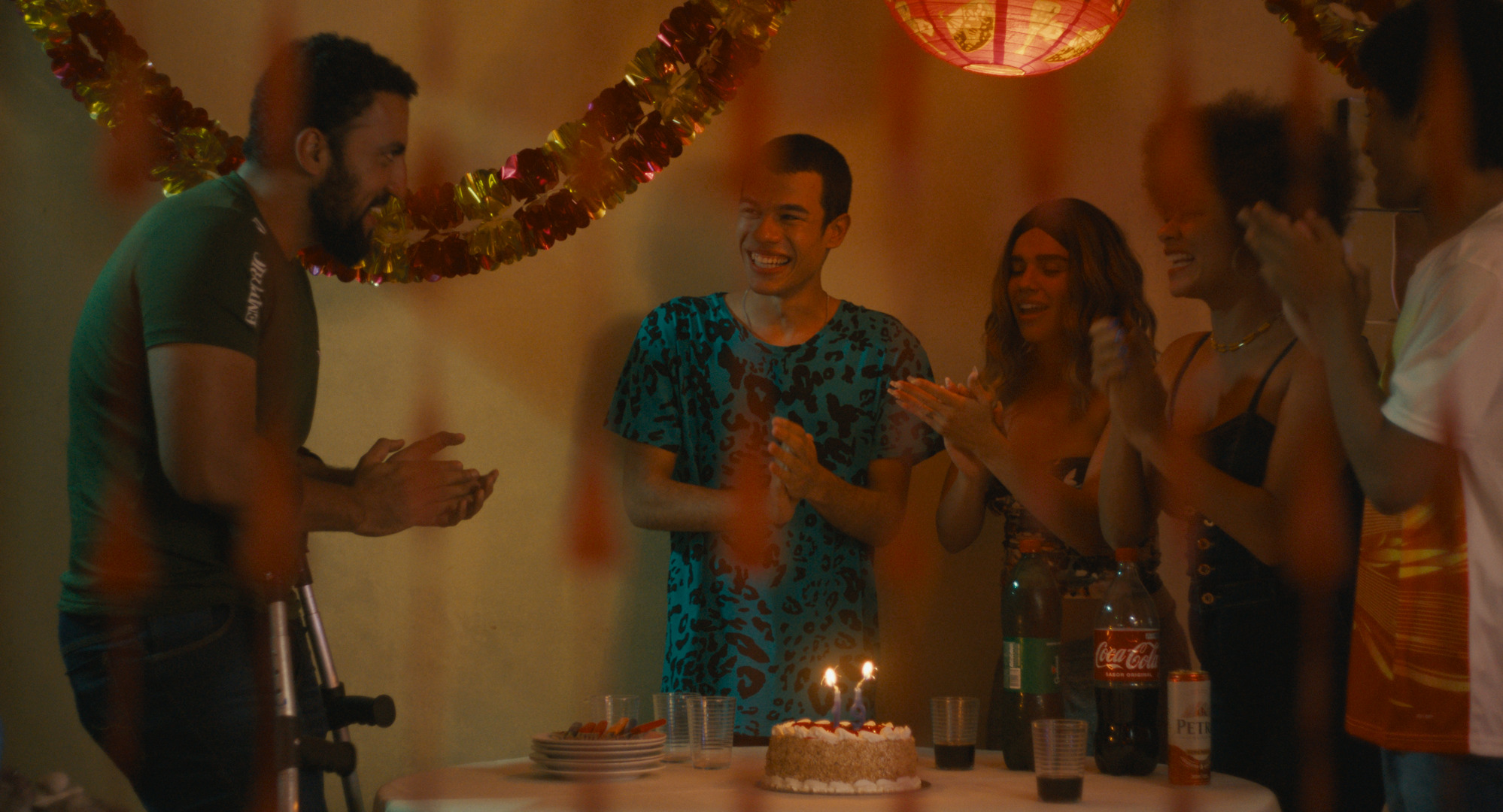 Still from a cheerful birthday party in the film Baby