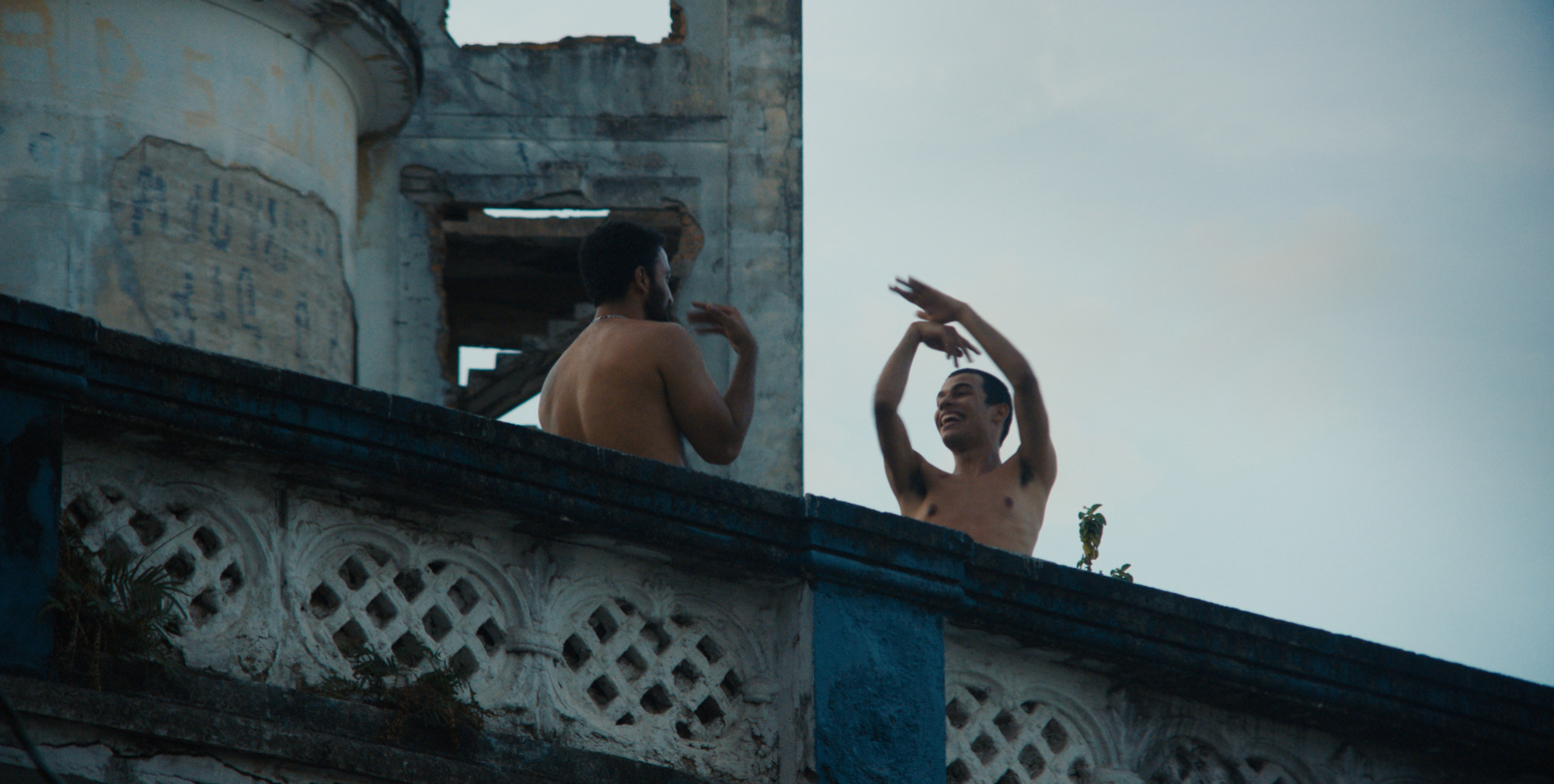 Characters dancing on a rooftop